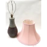 Large textured pottery lamp base with pink shade. Lampbase approx 14" tall