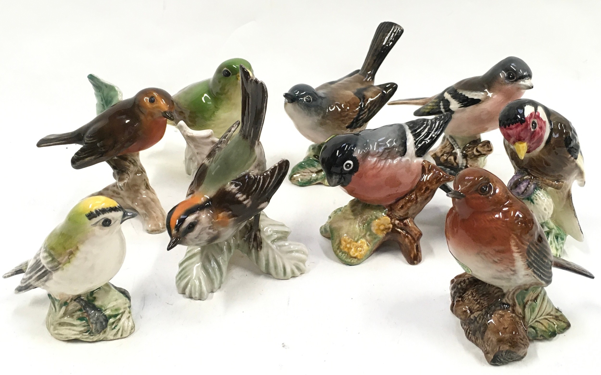 Selection of ceramic bird figurines to include Beswick and Goebel examples. 9 in lot