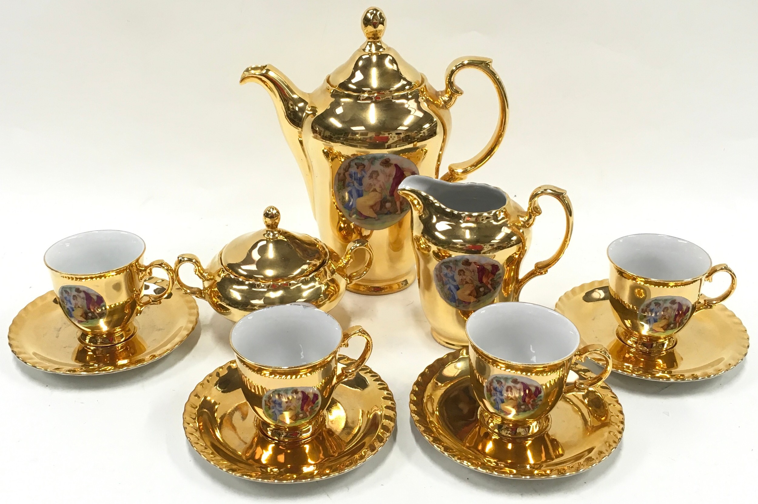 Vintage coffee service by Thun porcelain of Czechoslovakia, presented in a high gloss gilded finish.