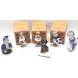 Royal Copenhagen figures 3 boxed playing children, 2 kneeling children , and a dog on a cushion