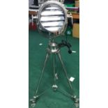 A large spot light on stainless steel stand. (258)