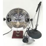 A vintage Pifco Sunlamp together with a modern angle poise lamp.