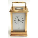 Brass cased carriage clock with key, retailed by St James London working