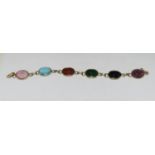 Multi natural gemstone 9ct gold scarab bracelet.