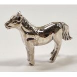 A silver figure of a horse.