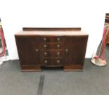 Vintage large mahogany sideboard by P Goddard & Sons. Comprising centre set of 4 graduated drawers