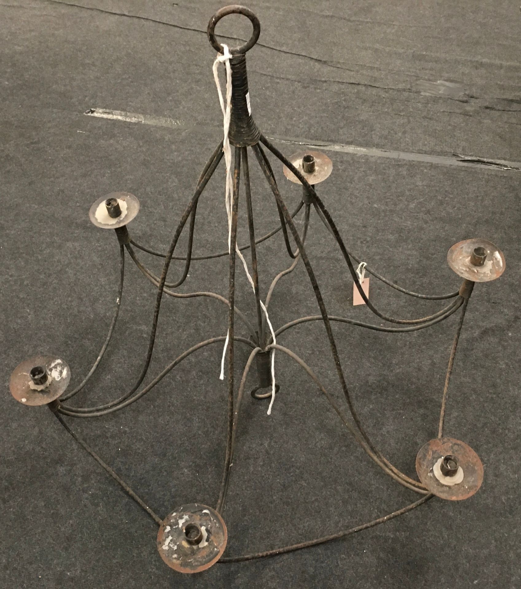 Large rustic cast metal six branch candelabra. Approx 36" across x 34" tall