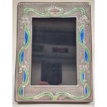 A silver and enamel Art Nouveau style easel back picture frame.