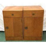 A pair of 1950s Stag Furniture bedside cabinets each fitted with one drawer above cupboard each