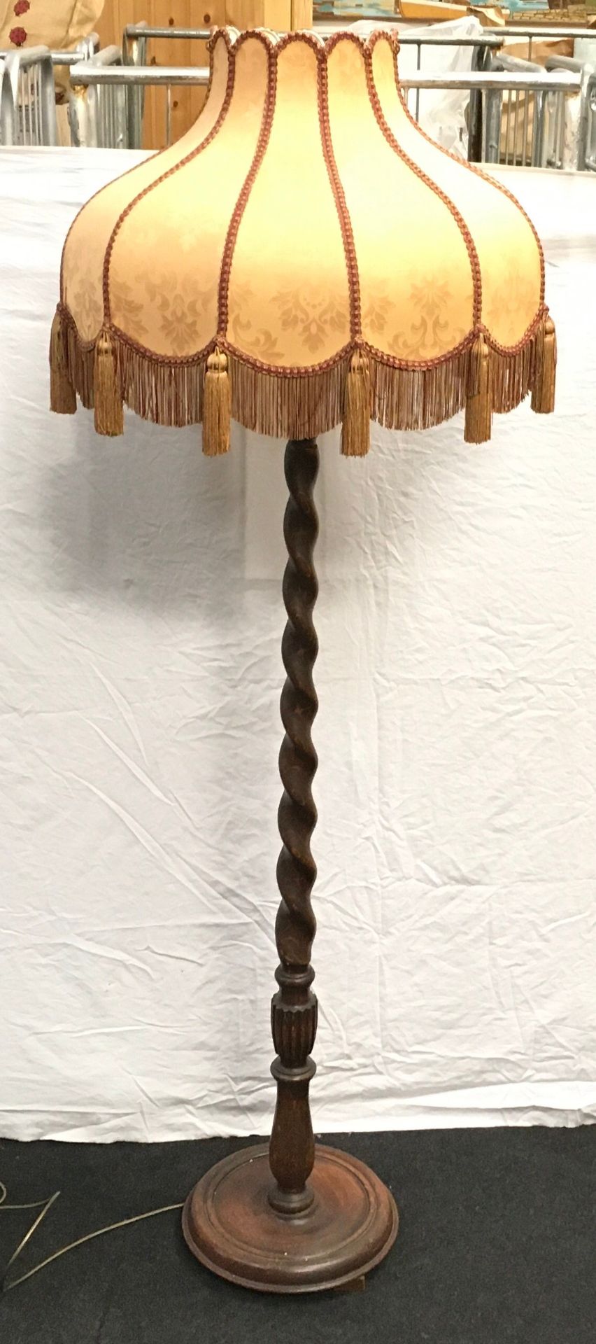 Attractive oak standard lamp with barley twist stem and a good quality tasselled shade. O/all height