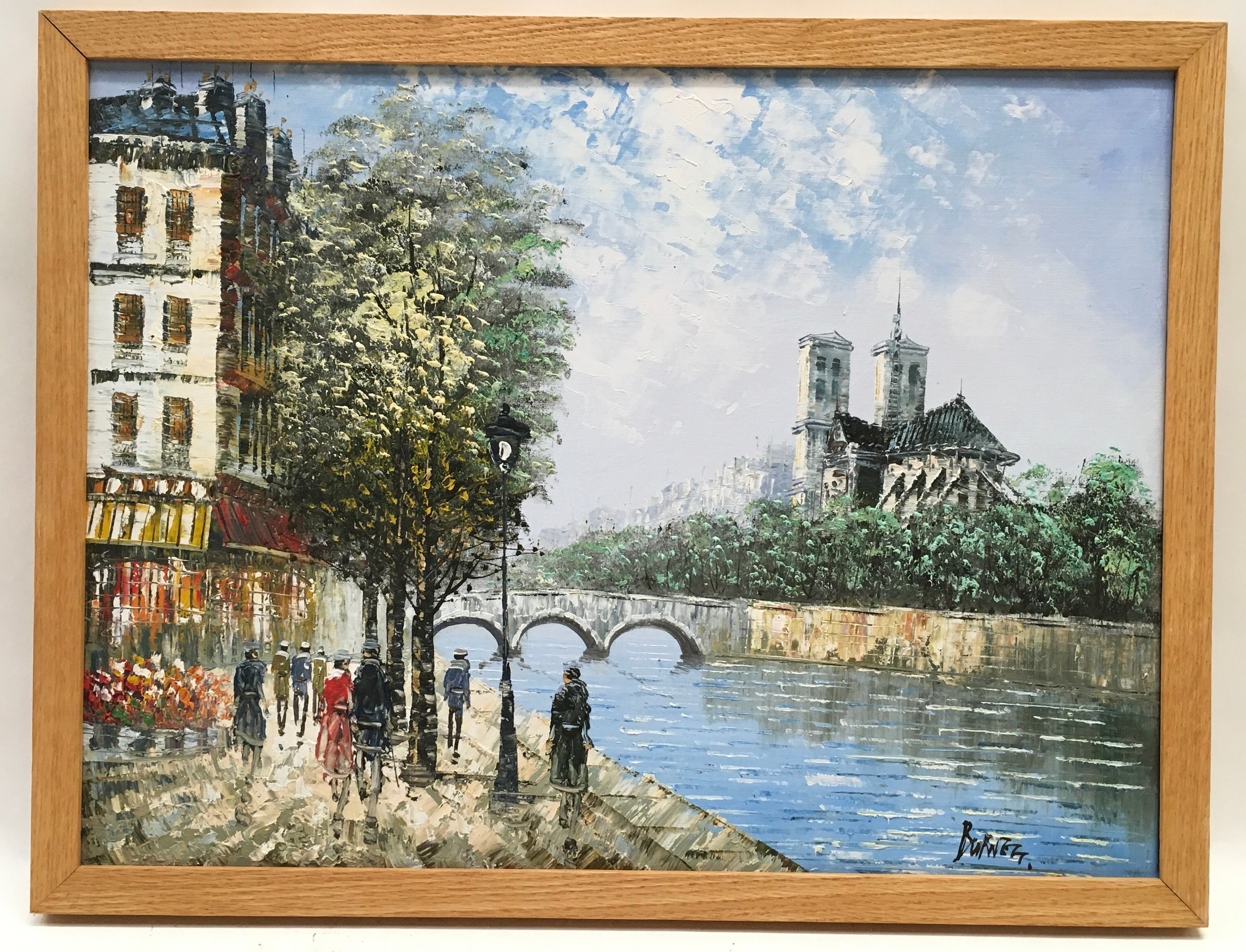 Framed oil on canvas of a Parisian river scene signed "Burnett" 66x50cm.