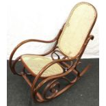 Impressive bentwood rocking char with rattan support in the style of Thonet