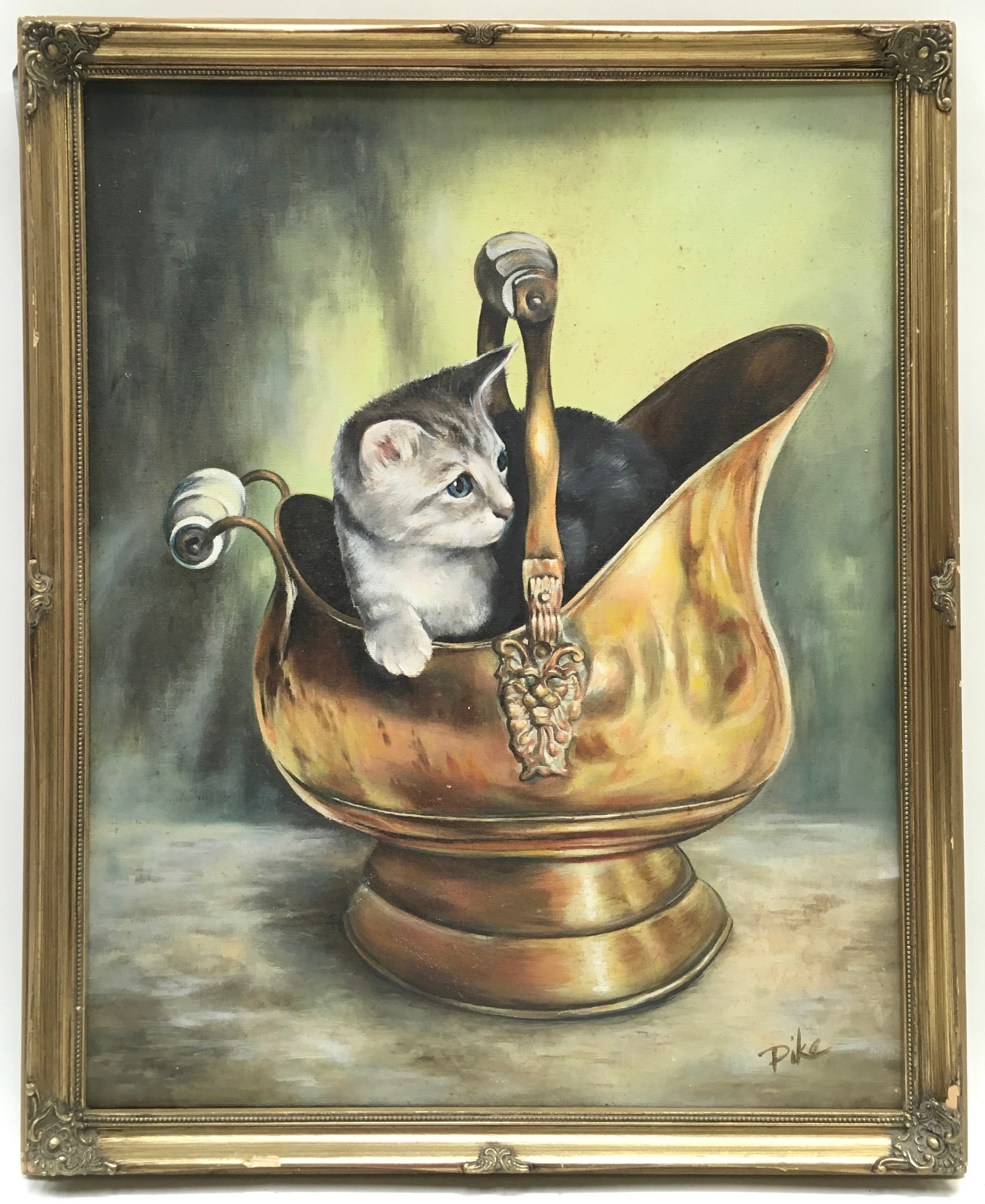Gilt framed oil on canvas painting of a kitten in a coal scuttle signed "Pike" 46x56cm.