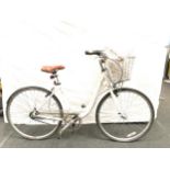 A Raleigh Caprice White pushbike with wicker basket. (113)