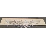 A Stainless steel Aston Martin exhibition sign mounted on slate board 300x72cm total size.
