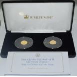 A boxed pair of 9ct gold sapphire Jubilee coins.