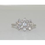 A sparkling 925 silver and CZ flower ring, Size R