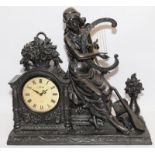 Large bronzed resin mantle clock featuring a classical Muse. 53cm across