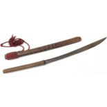 WWII Japanese sword with bamboo scabbard, cord grip and red cord holder. Obtained by the vendors