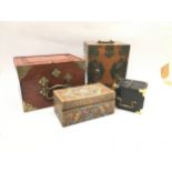 Four oriental style wooden boxes.