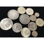 Small collection of US coins to include 1886 and 1887 silver Morgan dollars and a 1972 Eisenhower