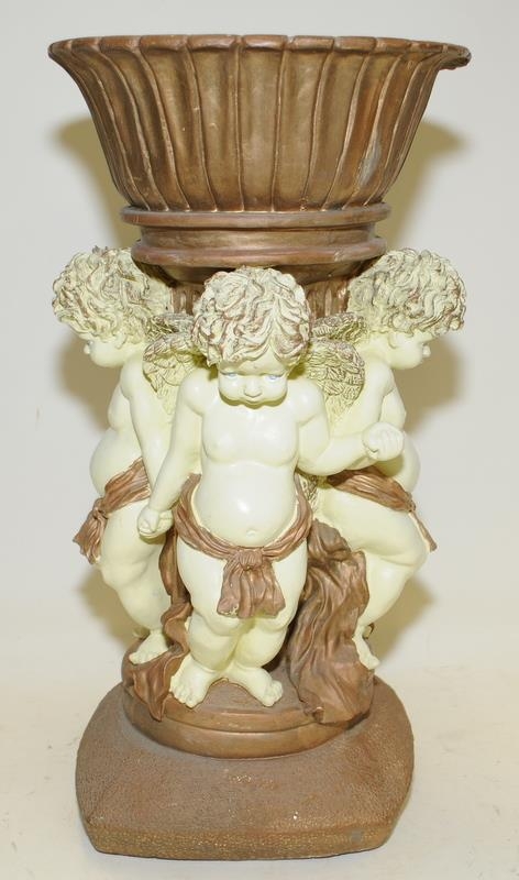 Large decorative resin plant stand featuring gilded bowl supported by Putti's. 48cms tall