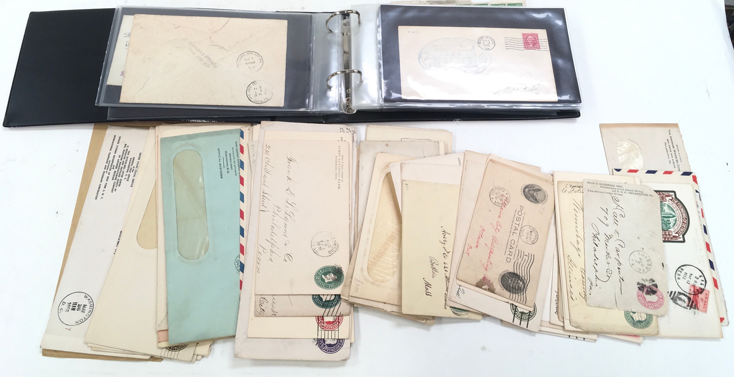 125 United states covers/postal stationary in bag and small album