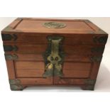 Oriental style brass bound wooden jewellery box, hinged top over three drawers