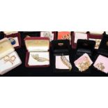 Collection of Danbury Mint Sterling Mint real gems costume jewellery, mostly brooches. All boxed