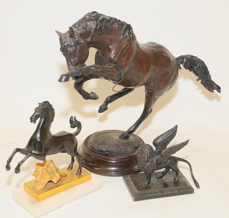 Three cast metal animals to include a large bronze rearing horse with indistinct signature to