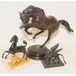 Three cast metal animals to include a large bronze rearing horse with indistinct signature to