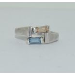 A 925 silver ring with blue stone, Size Q 1/2.