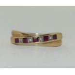 9ct gold ladies Ruby and Diamond cross over ring size O