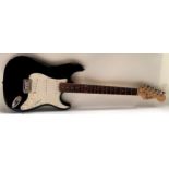 A Squire Strat by Fender electric guitar. (48)