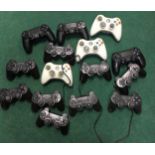 Collection of Xbox and PlayStation controllers. WP.