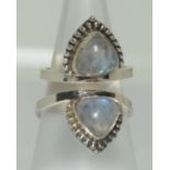 An unusual 925 silver and moonstone double ring, Size between K & M.