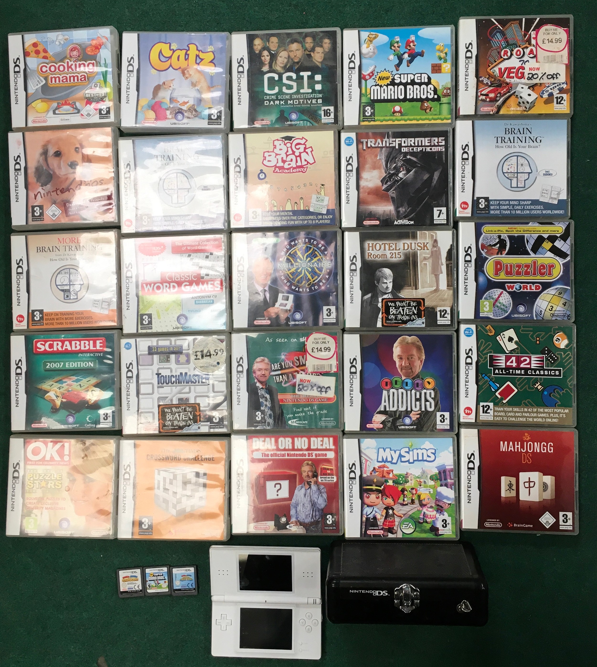 Nintendo DS Lite games consoles together with a large quantity of games. WP.