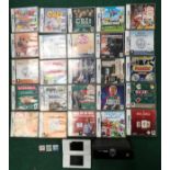 Nintendo DS Lite games consoles together with a large quantity of games. WP.
