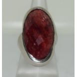 A very large 925 silver ring with red stone Size O