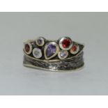 An unusual silver and gold on silver ring set with semi precious stone, marked 925 and 46.59