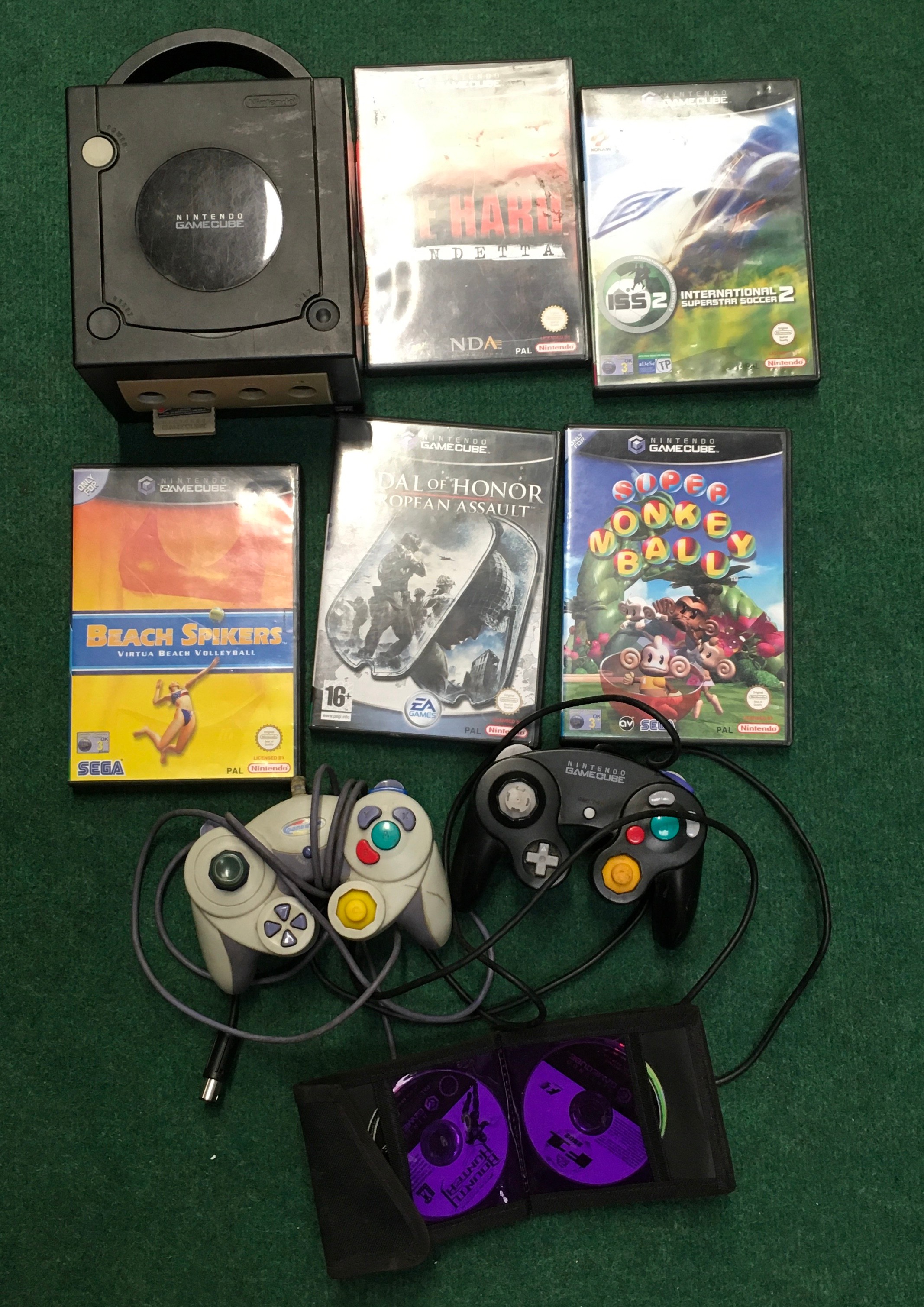 Nintendo GameCube consoles with games and controller. WP.