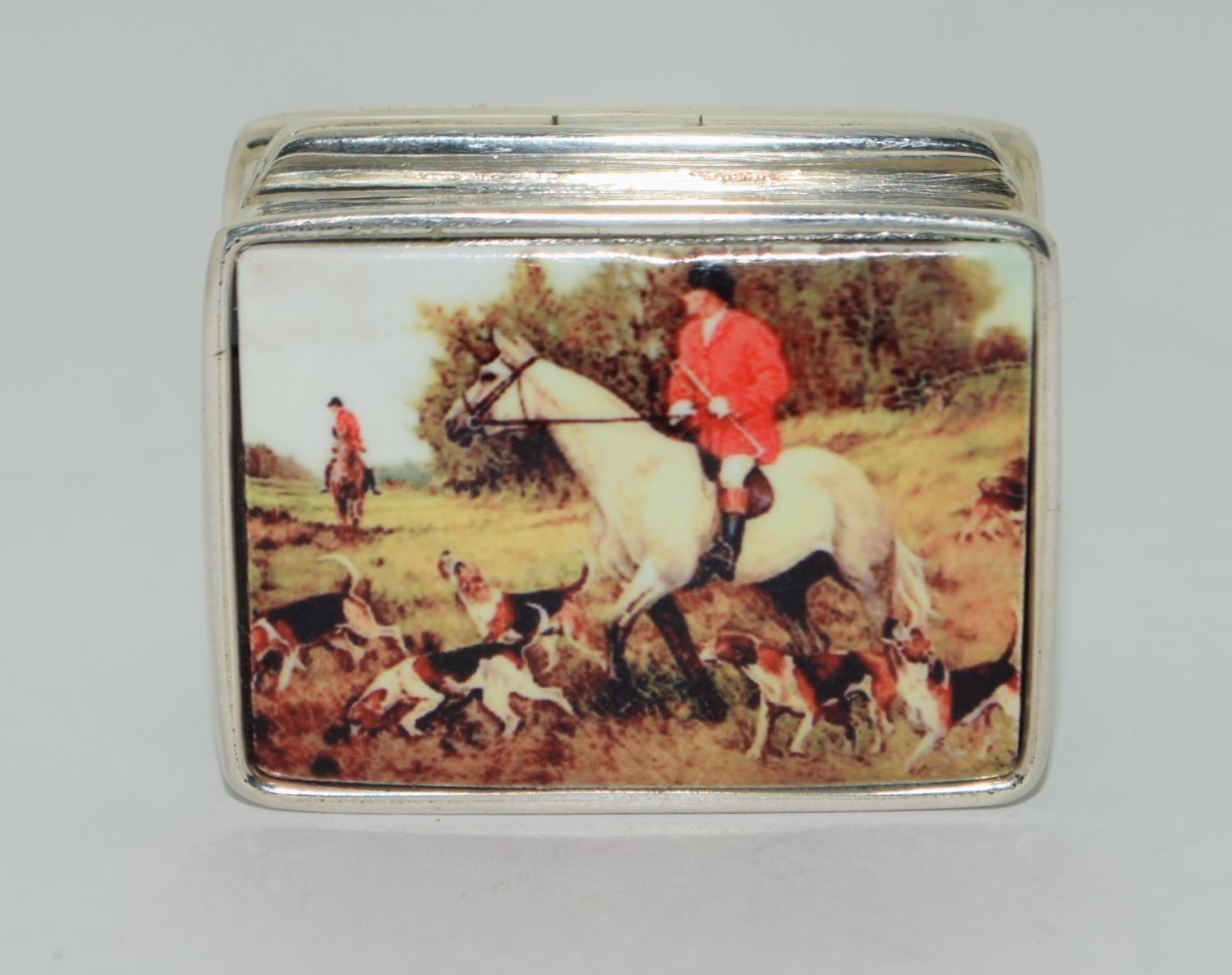 A Silver enamel pill box with enamel decoration.