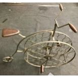 Penny farthing bike style floor standing wine rack.