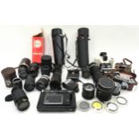 Large collection of various camera lenses together with some vintage cameras and accessories.