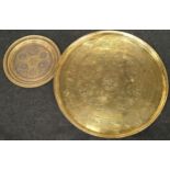 Two decorative copper/brass chargers the largest having a diameter of 58cm.