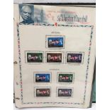 A folder containing Sir Winston Churchill stamps (unfranked).