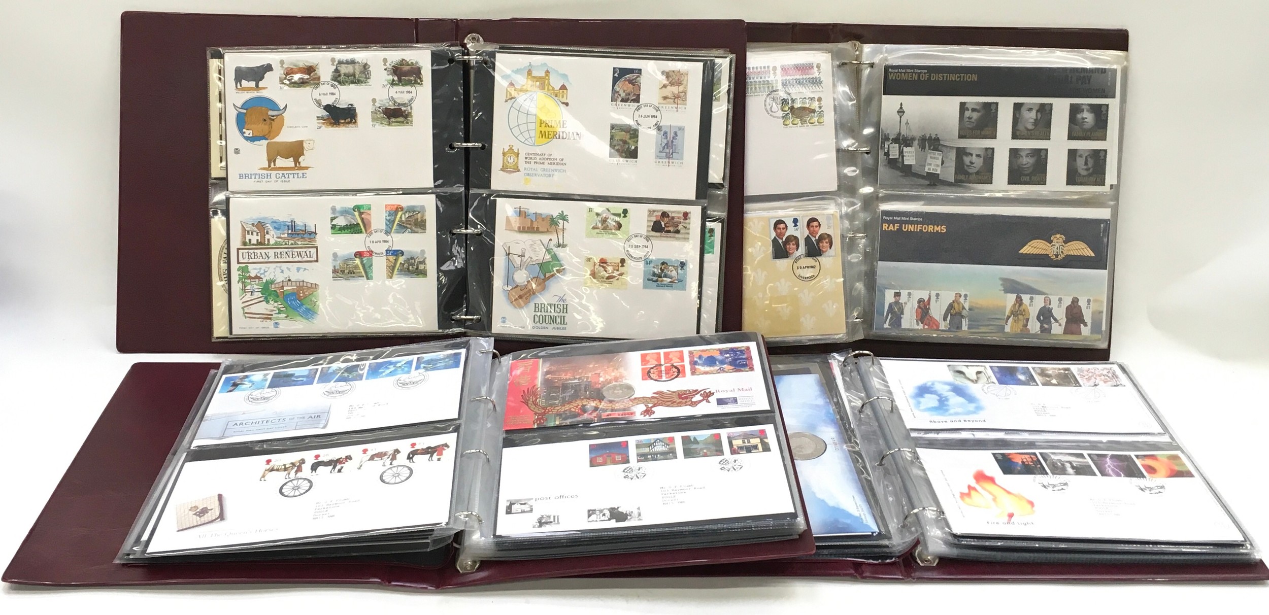 4 albums containing First Day Covers.