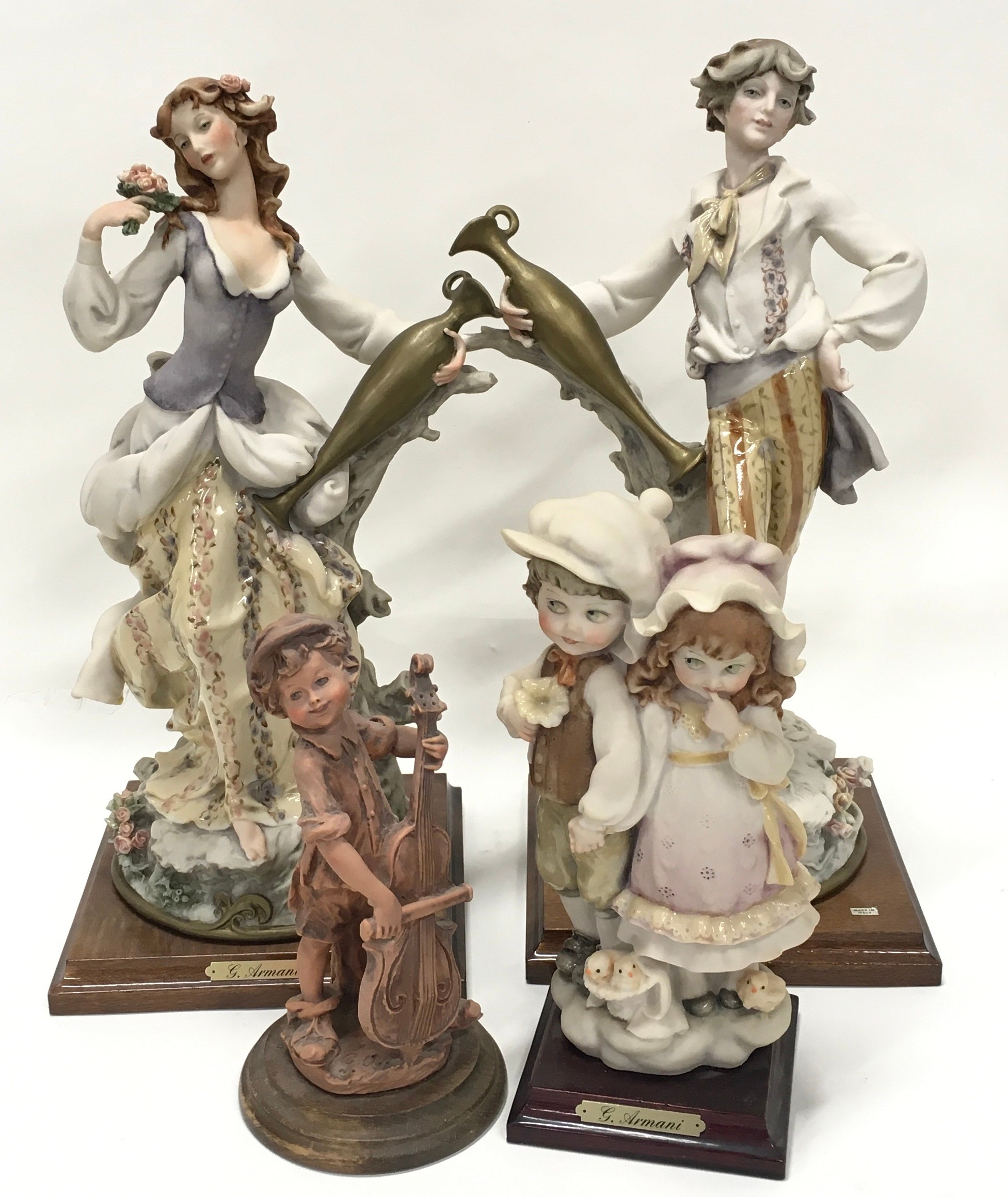 Box containing collection of four resin "Florence" Bisque figurines on wooden plinths (sold on