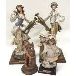 Box containing collection of four resin "Florence" Bisque figurines on wooden plinths (sold on