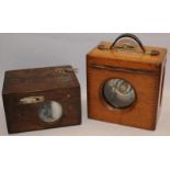 Two vintage wooden cased pigeon racing timer clocks by The Automatic Timing Clock Co. and B